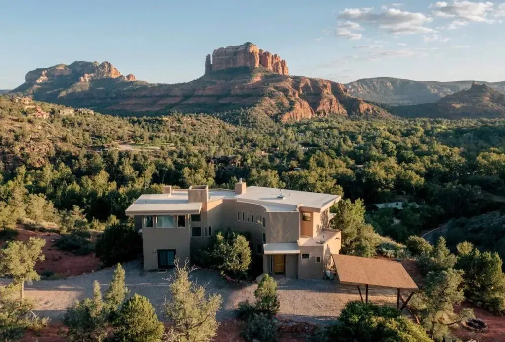 Elevate Luxury Retreat — The retreat is set on sacred land in Sedona, Arizona, specifically at a private property called Sky Castle. It boasts breathtaking views of Cathedral Rock Vortex and sits dramatically on the edge of a wild gorge, immersing guests in the powerful natural beauty of the region.