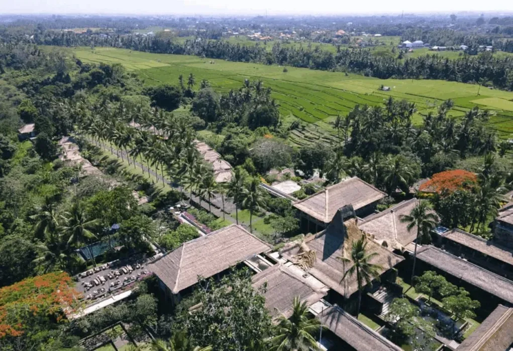 EVOLVE WELLNESS — Deep within Bali's cultural heart, EVOLVE WELLNESS unfolds across a sprawling 10-hectare tropical landscape. The resort's design is inspired by an ancient village, with palm-fringed contours leading to a hidden river valley. The grounds follow sacred Balinese wisdom, creating a harmonious environment that connects guests with spiritual realms.