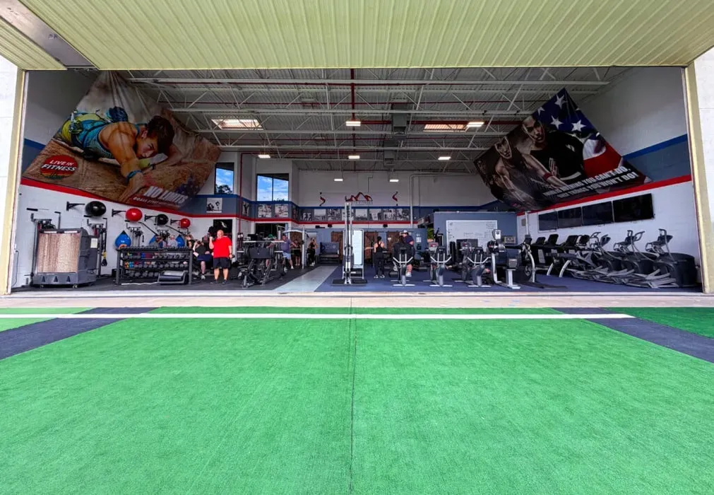 Fitness Retreat — Located in Scottsdale, Arizona, the training venue, Hangar 9, is a converted aircraft hangar next to Scottsdale Airport. The surrounding area is typical of a bustling city, with retreat residences nearby designed to offer comfort and focus away from the training intensity.