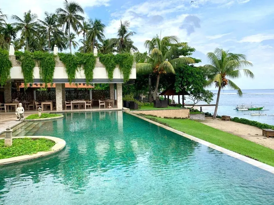 Flametree Yoga Studio — Situated directly on the beachfront in Bali, the center provides a serene and picturesque environment. Guests have immediate access to the ocean for swimming and snorkeling, with the added charm of a nearby traditional Balinese village offering cultural experiences and local shopping.