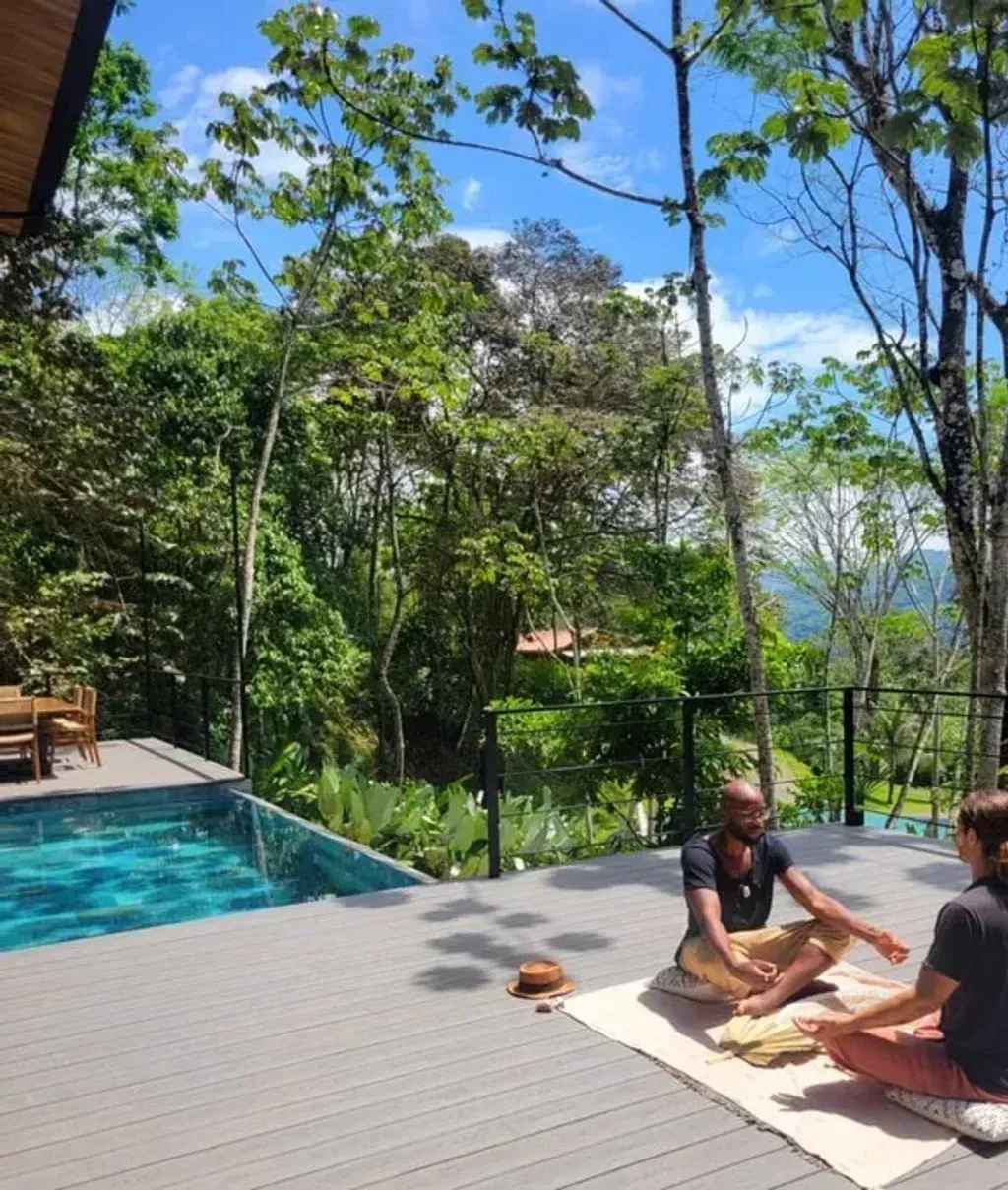 Flourish Within — Perched on the edge of the world in the lush, fertile jungle of Costa Rica's Southern Pacific side, Flourish Within offers a truly immersive natural experience. The air is thick with the sounds of the jungle, and the views are expansive, stretching towards the Pacific Ocean. It's a vibrant, tropical environment designed to foster deep relaxation and connection with nature.