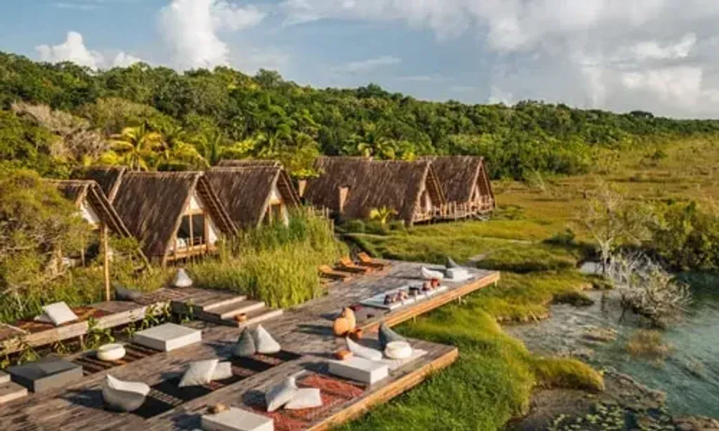 Guru Arjan — Located in Bacalar, the center is set within a natural environment, likely offering views and access to the region's famed lagoon. The atmosphere is designed to be harmonious and joyful, fostering a connection to nature as part of the meaningful process.
