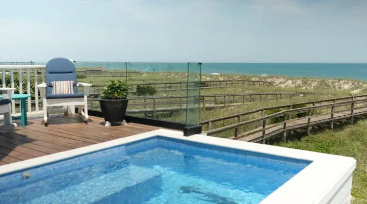 Healing Begins Within — Perched above the ocean in Kure Beach, North Carolina, this private retreat home offers expansive decks and breathtaking views of the beach. The atmosphere is designed for tranquility and reflection, with natural light filling indoor spaces and peaceful spots for sunrise yoga and healing under the stars.