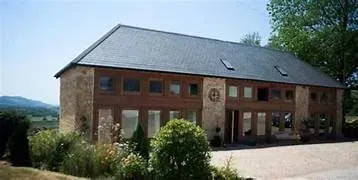 Hills Farm Wellness Retreats — Hills Farm is situated in Kilmington, offering easy access by both road and rail. While specific details about the immediate landscape are not provided, the emphasis on "outdoor wellness" suggests a natural, calming environment conducive to relaxation and connection.