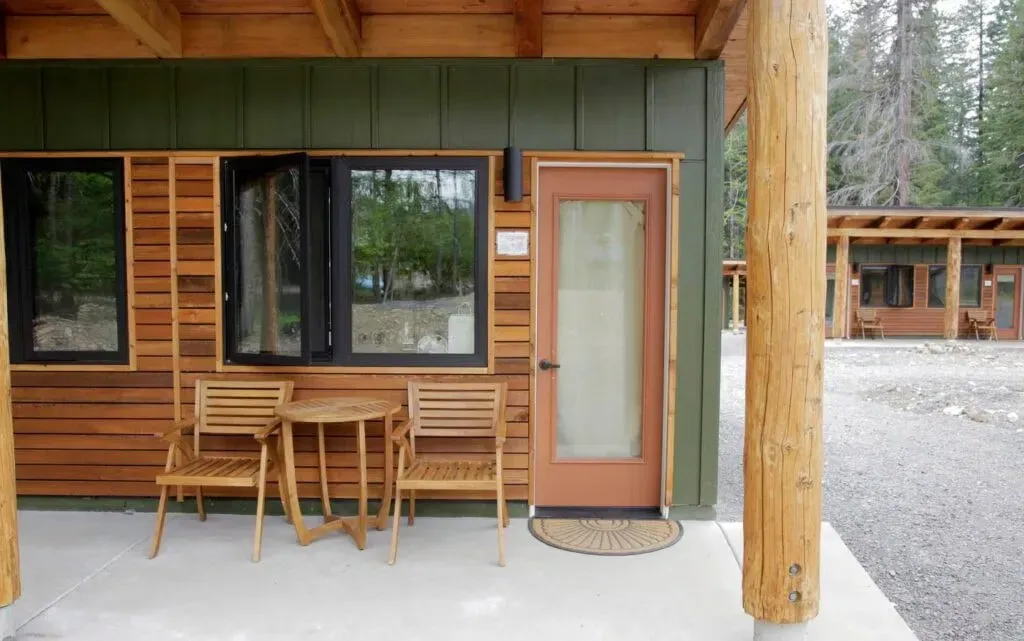 Incite Agency for Change, LLC. — The center is situated in Idanha, with the historic 1920s Lodge at its core. The surrounding area is characterized by natural beauty, with specific directions warning against GPS use due to logging roads, hinting at a secluded and immersive environment. Large decks offer pleasant outdoor dining spaces, suggesting a connection with the natural surroundings.