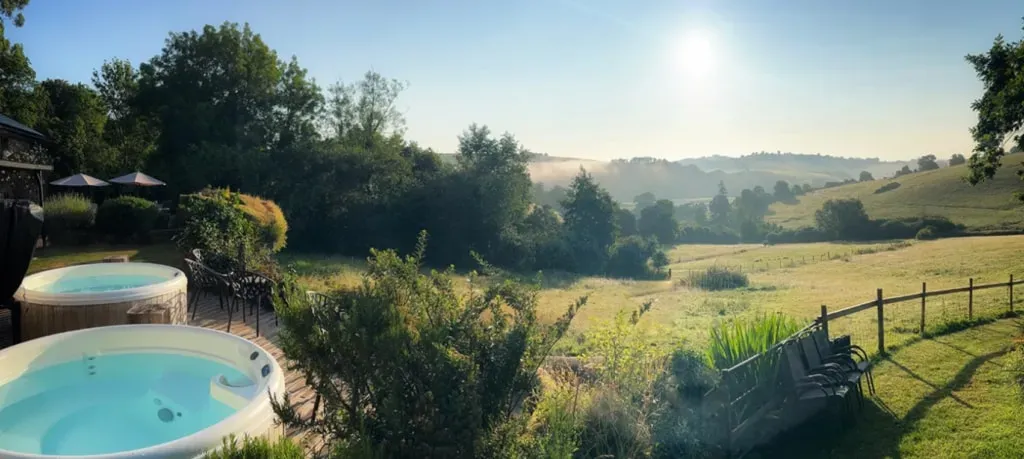 Inner Earth Retreats — The Shippon, a beautiful rustic barn, is set in the peaceful countryside of Totnes, Devon. Guests are surrounded by nature, with breathtaking views of the River Dart, offering an idyllic backdrop for rest, relaxation, and self-discovery.