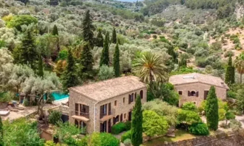 Jennifer Ruiz Goupil — The retreat is set amidst ancient olive groves in Sóller, Illes Balears, offering a tranquil and picturesque environment. The estate itself comprises two beautifully renovated 16th-century Mallorquin mansions, exuding character and original flair. The atmosphere is one of serene historical charm, providing a peaceful backdrop for reflection and rejuvenation.