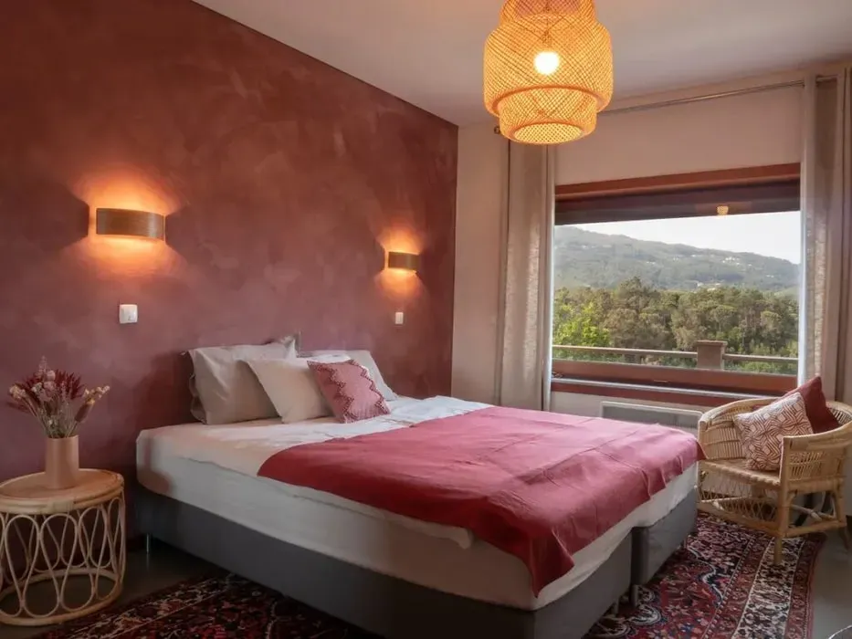 Julia and Amelia Retreats — The retreat unfolds in a picturesque villa set in the Portuguese countryside, just outside of Porto. Surrounded by nature, the property boasts a serene garden, a calming river, and balconies in every bedroom, offering a peaceful and restorative atmosphere.