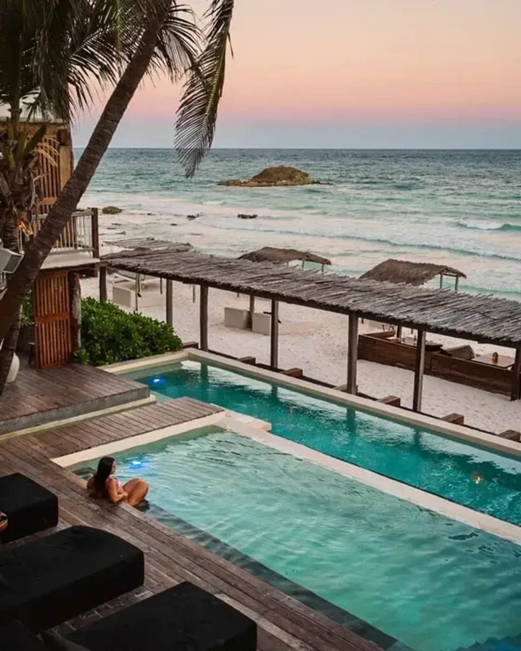 Kate Kettelkamp — set on the vibrant Tulum Beach, the center boasts a stunning beachfront location directly on the Caribbean Sea. Open-air yoga shalas offer breathtaking ocean views, while the relaxed, eco-chic accommodations are thoughtfully designed to harmonize with the natural surroundings. The atmosphere is one of serene tranquility, blending seamlessly with the tropical landscape.