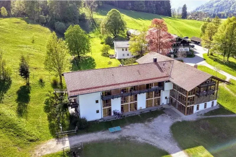 Kathrin & Marta — The center is located at Froschsee 7 in Ruhpolding, Germany. While specific details about the surrounding landscape are not provided, the address suggests a tranquil setting, likely offering a peaceful atmosphere conducive to mindful practices.