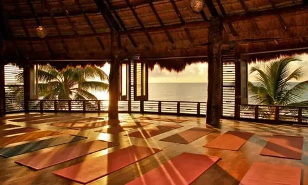 Katy Brooks Yoga — set on the beautiful Tulum Beach, Amansala Resort offers an idyllic setting for a yoga retreat. The focus on eco-sustainability means you'll be surrounded by natural beauty, with most areas of the property providing stunning views of the ocean. It's a serene escape where the sounds of the waves and the gentle sea breeze enhance the meditative atmosphere.