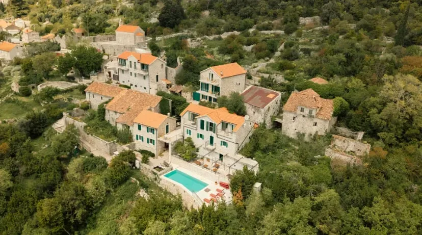 KindMind — Perched 180 meters above the Adriatic Sea on Montenegro's Luštica Peninsula, Klinci Village Resort provides a serene backdrop for KindMind. The area is characterized by its natural beauty, with local olive groves and herbs contributing to the tranquil atmosphere. This family-owned resort is designed to help guests slow down and reconnect with nature.