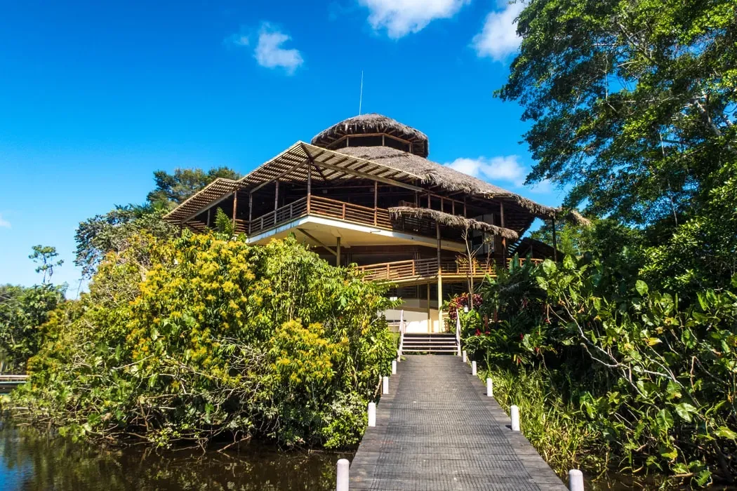 La Selva Amazon Ecolodge & Spa — set on the serene Garzacocha Lagoon within the Yasuni Biosphere Reserve, La Selva Amazon Ecolodge & Spa offers an unparalleled immersion into the Ecuadorian Amazon. The atmosphere is one of profound tranquility, punctuated by the vibrant sounds of the rainforest, with lush greenery and diverse wildlife surrounding the lodge.