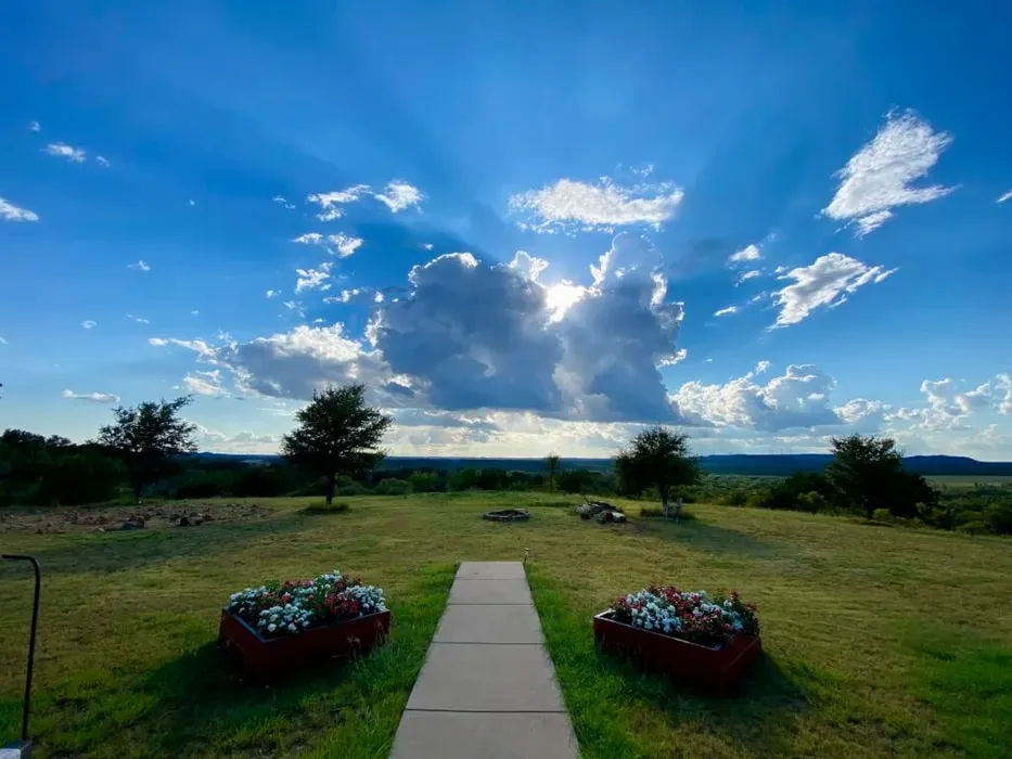 Lightning Ranch Intentional Community & Wellness Center — Located in Merkel, Texas, the center is set within a landscape dedicated to regenerative agriculture. The atmosphere is one of conscious community, focusing on working together towards shared goals of whole-body wellness and environmental stewardship. It's a place where the beauty of nature and art are embraced in daily activities.
