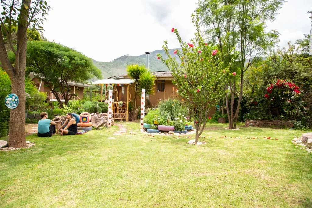 Liz Diaz — set in an undisclosed location, the Kawsay Tika – Centro de Luz ecolodge provides a warm and welcoming environment. The property boasts a unique ceremonial dome and a large greenhouse where much of the organic food is grown. The surroundings are designed to foster connection and a sense of belonging.