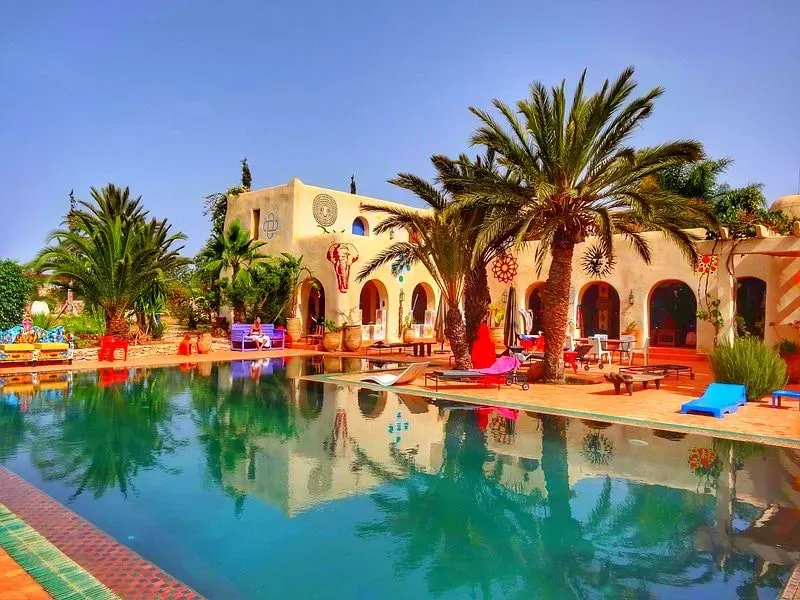 Lucile from Yoga Compass — This retreat unfolds just outside Essaouira, Morocco, within a private, art-filled riad. The venue is designed with handcrafted Moroccan details, offering peaceful courtyards, sunlit terraces, and cozy communal spaces. It's an environment that blends local charm with a serene atmosphere, well suited to introspection and connection.
