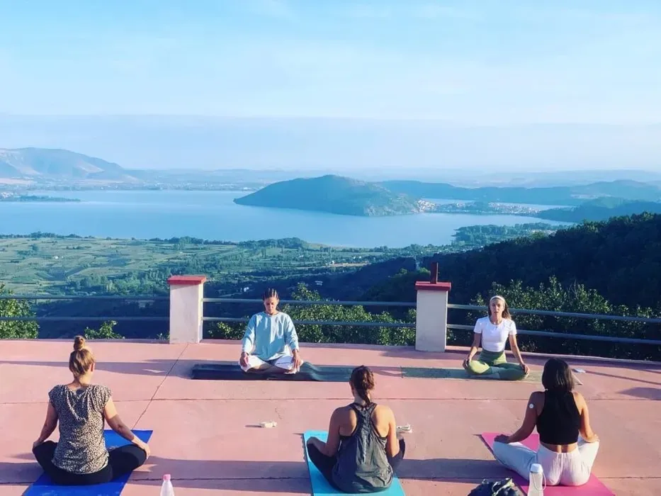 Luxury Yoga Retreats Kastoria — Perched in the unspoiled hills of Kastoria, the Loggas Hotel offers panoramic views and a direct connection to nature. The atmosphere is one of serene luxury, blending comfort and style with a commitment to healthy living and environmental sustainability. It's a place where the beauty of the Greek landscape meets thoughtful design.