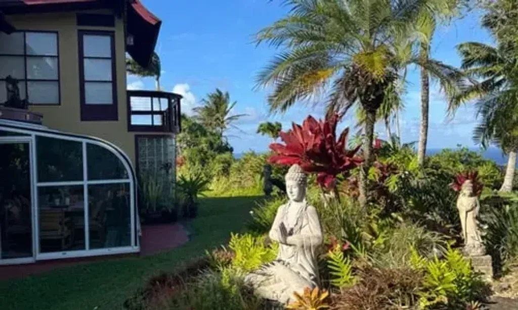 Manifesting Moksha — Perched on the dramatic Huelo cliffside, the retreat is enveloped by vibrant jungle and boasts multiple accessible waterfalls within its private grounds. This secluded setting offers a profound connection to Maui's 'aina (land), providing a serene and inspiring backdrop for deep healing and exploration.
