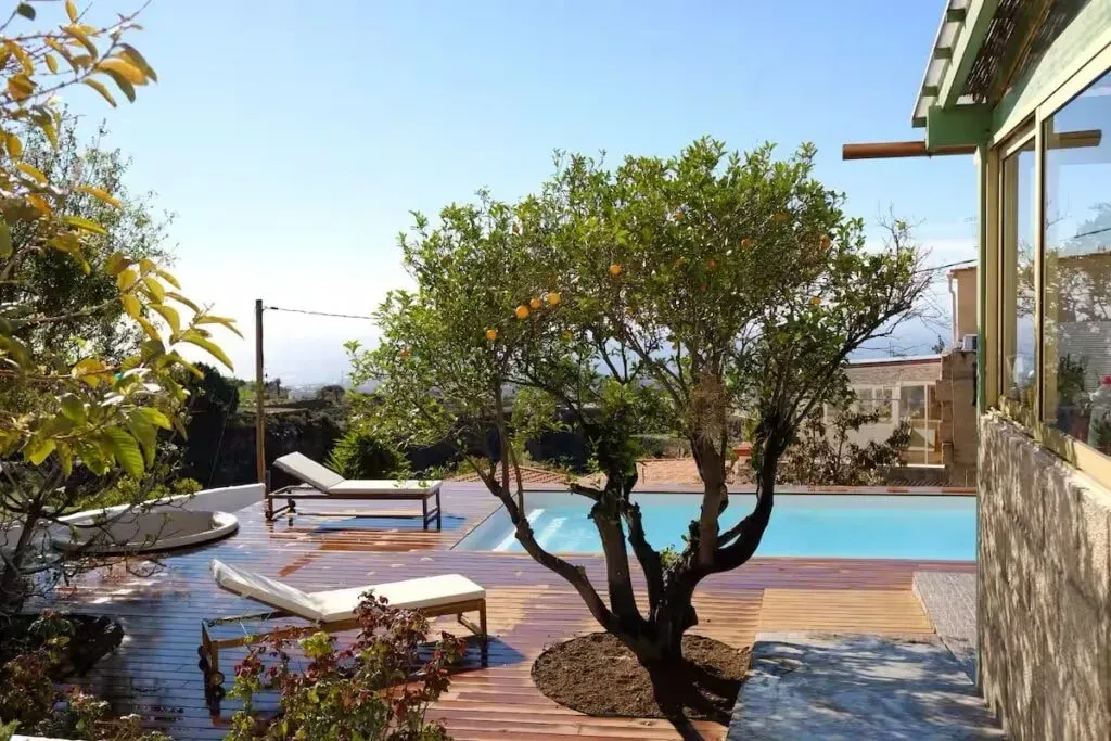 Markus Maisel — Casa Jio is set in the south of Tenerife, offering a warm and welcoming space that blends island energy with a tranquil atmosphere. The property boasts open terraces, a lush garden with fruit trees, and a pool, all designed to invite both community and quiet reflection amidst the natural beauty of the island.
