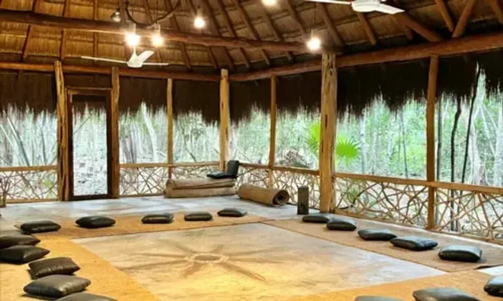 Marlin — set deep within the Mayan jungle of Puerto Morelos, the center is designed to blend seamlessly with its natural environment. The atmosphere is one of serene simplicity, with structures built to respect and integrate into the surrounding untouched landscape, creating an energetic space conducive to healing and introspection. Exclusive access to two cenotes adds to the unique natural allure.