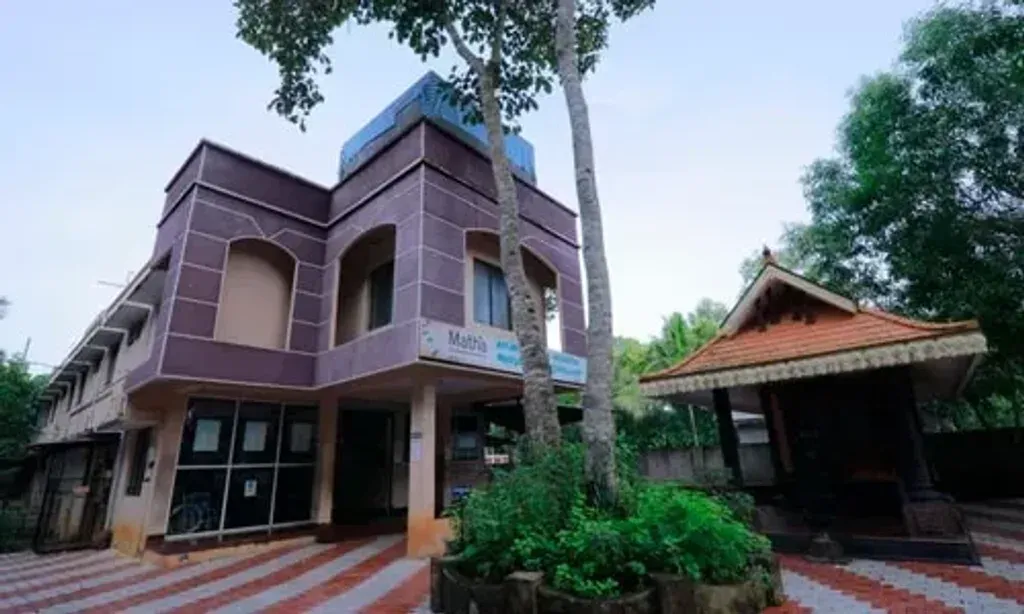Matha Ayurveda Eye Hospital & Panchakarma Centre — Located in Kudappanakunnu, Thiruvananthapuram, the center is situated in Kerala, a region renowned for its lush landscapes and deep-rooted Ayurvedic heritage. While specific details about the immediate surroundings aren't provided, the general atmosphere of Kerala suggests a tranquil and verdant environment conducive to healing and relaxation.