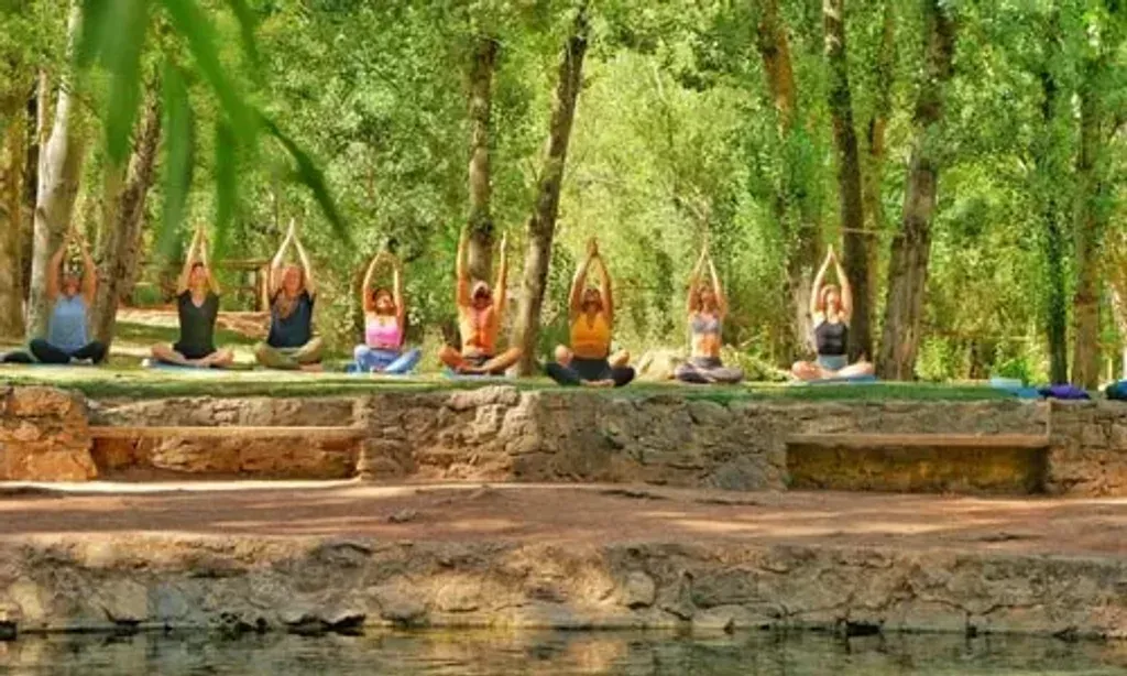 MIRACLE YOGA — set in a wooded valley beside a majestic, fast-flowing river, the venue offers breathtaking views of Mount Chirripo, Costa Rica's highest peak. Surrounded by natural countryside and lush vegetation, it provides unspoiled views of rolling hills, olive, and oak trees, creating a peaceful sanctuary.