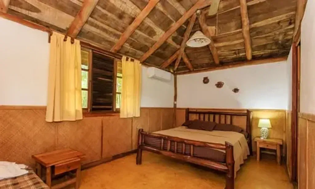 Movements By Viola Wang — Perched on a hillside in Cañafistula, near the lively town of Tamarindo, El Sabanero Eco Lodge offers breathtaking views of the Cañafistula Valley. The lodge is surrounded by lush natural surroundings, providing a tranquil escape where guests can observe local wildlife. Its strategic location places it conveniently close to four of the area's most popular and beautiful beaches, easily accessible by shuttle.
