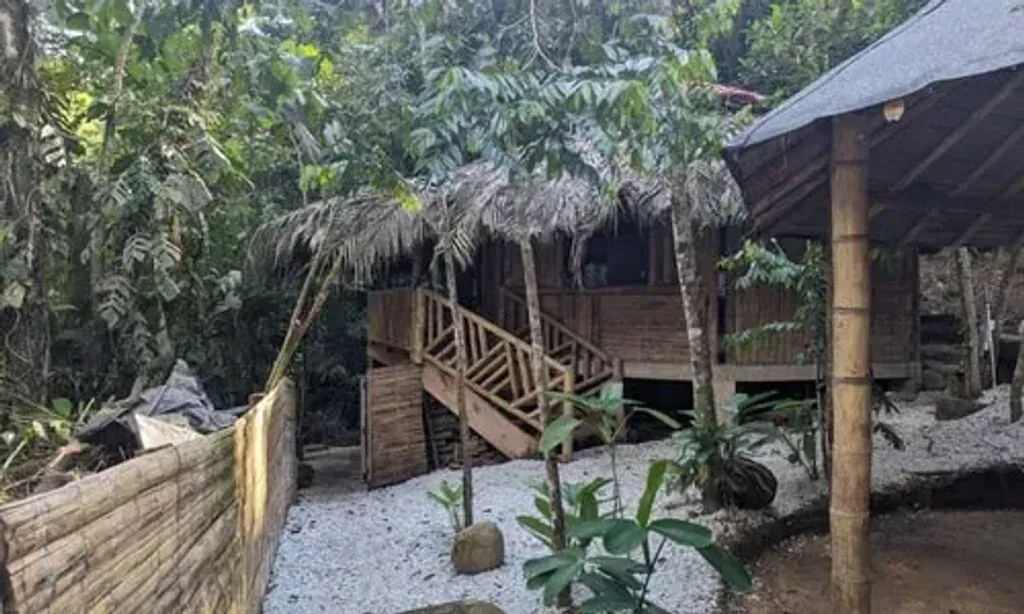 Mundo Profundo — The center is situated amidst the natural beauty of San Luis, Antioquia, Colombia, characterized by abundant waterfalls and lush landscapes. This serene environment provides a tranquil backdrop for deep introspection and healing, with a sacred Maloka designed to integrate ancestral wisdom into its very fabric.