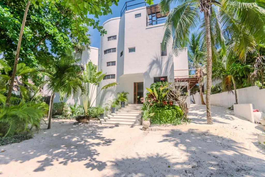 My Tulum Retreats — set along Tulum's famous beach road, the center is surrounded by lush tropical greenery, offering a tranquil escape. The atmosphere blends serene natural beauty with a chic, modern boho aesthetic, creating a space that feels both luxurious and deeply connected to its environment. You'll find quiet nooks for contemplation and open spaces designed to embrace the jungle views.
