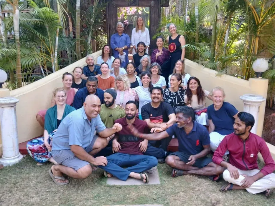 Naga's Retreat — The retreat is set on Querim Beach in North Goa, India. Its venue is described as a 'living temple' where earth and sky embrace, open to the natural elements. Sunlight filters through leaves, and firelight dances in ceremony, creating a deeply connected and harmonious atmosphere.