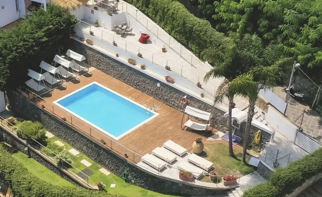 Napoli — set on the picturesque Island of Ischia, the center enjoys a prime location in Casamicciola Terme. It's just a short stroll from sandy beaches, the bustling port, and convenient public transport links. Guests can enjoy scenic waterfront walks, explore local shops, and witness breathtaking sunsets over the sea. The hotel grounds feature an outdoor pool, a solarium, and a unique park adorned with contemporary sculptures and fragrant plants, creating a serene and inspiring atmosphere.