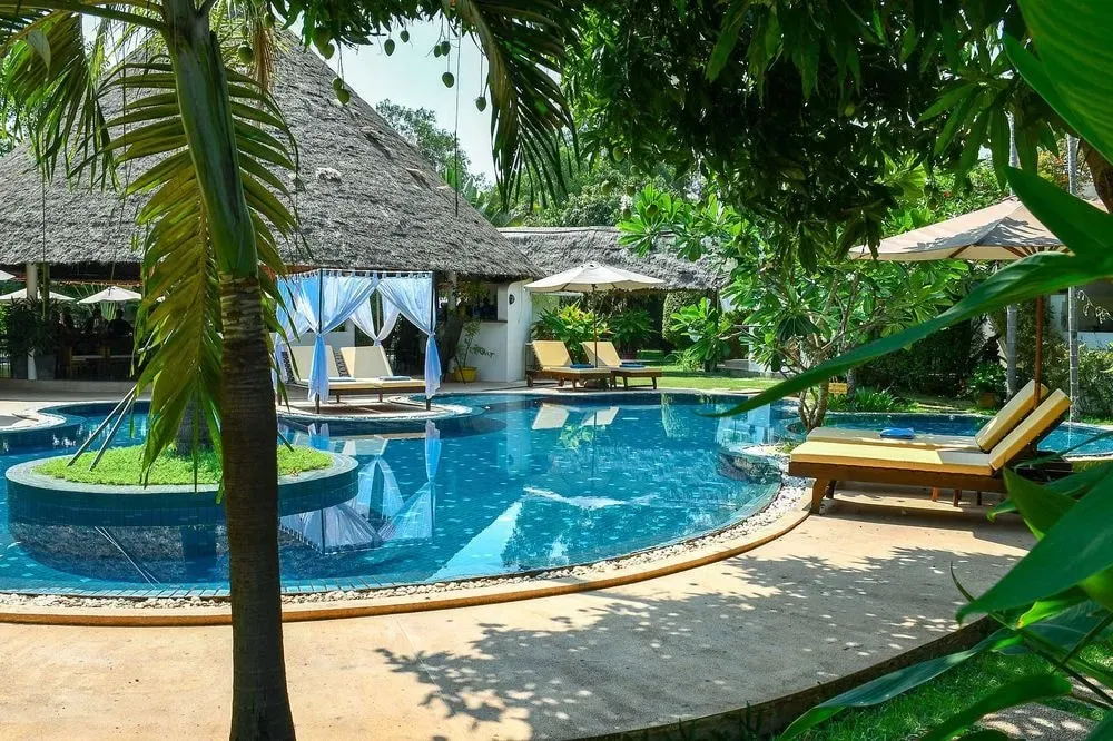 Navutu Dream Resort & Wellness Retreat — The resort is set amidst lush tropical gardens in Siem Reap, creating a peaceful sanctuary. Despite being just a short drive from the bustling town center, the environment feels secluded and serene, with the spiritual energy of nearby Angkor Wat adding to its unique atmosphere.