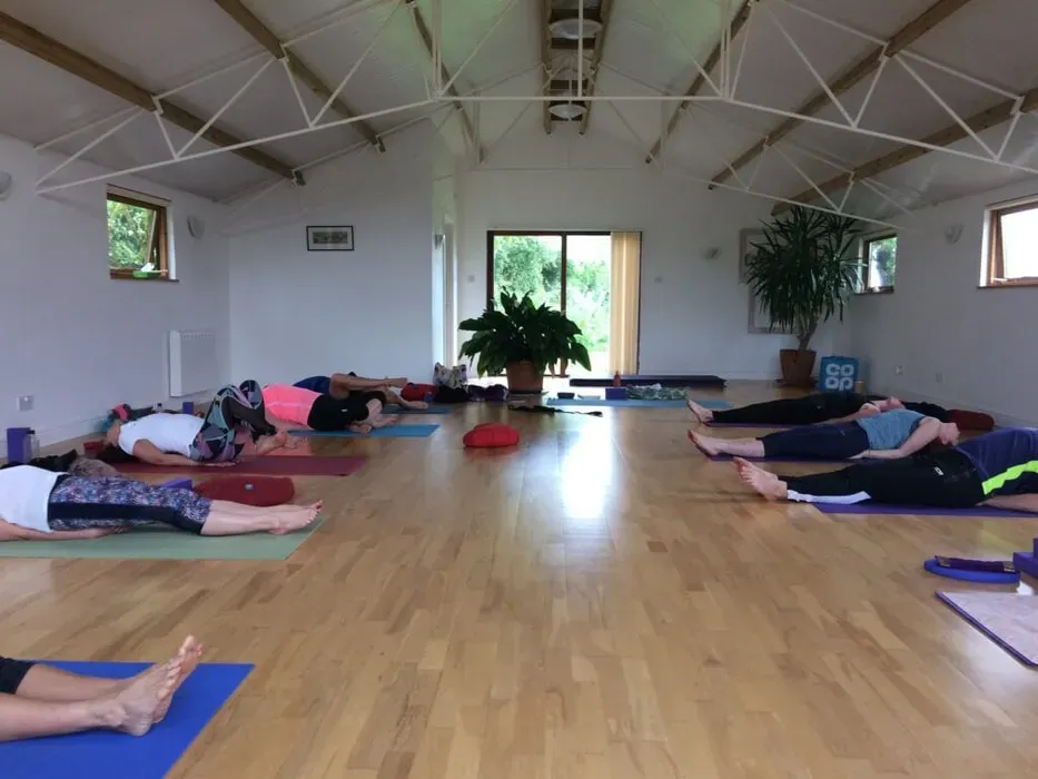 Nicky Harper — The center is set in the peaceful countryside of Eastbourne, offering a tranquil escape. The practice space, 'The Old Dairy,' is particularly charming, with its light-filled interior and views of a donkey paddock, providing a unique and calming backdrop for your yoga sessions.