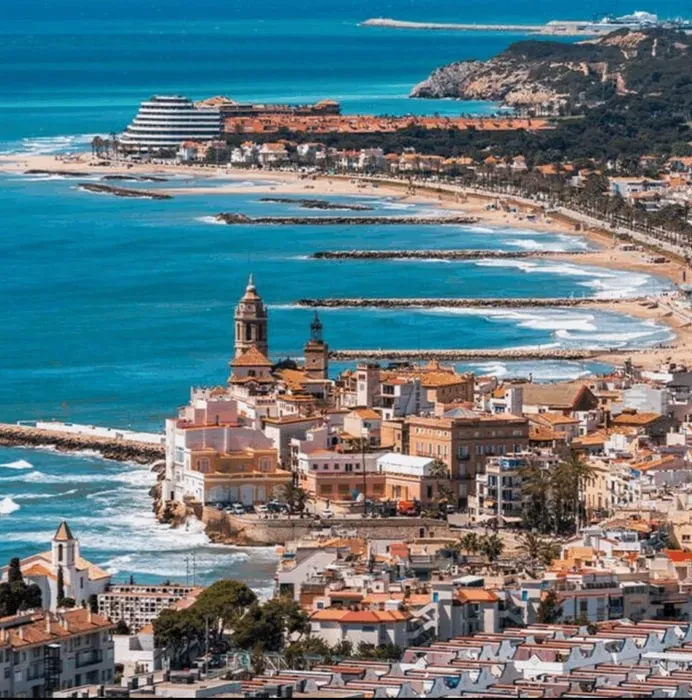 Ocean of Presence Retreat — Sitges, a vibrant coastal town south of Barcelona, provides a picturesque setting with its golden Mediterranean beaches, charming historic old town, and a relaxed cultural rhythm. The retreat is situated within this lively yet tranquil environment, offering guests the best of both worlds: serene moments by the sea and engaging strolls through cobbled streets.