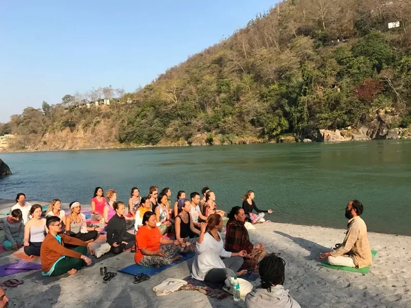 Om Shanti Om Yoga School — set near the sacred Ganga River in Rishikesh, the center is conveniently located just a short walk from the famous Laxman Jhula. The area offers a vibrant spiritual atmosphere, blending ancient traditions with a lively community.
