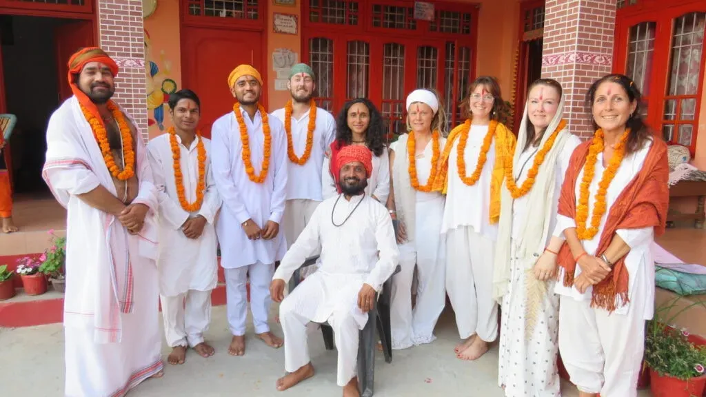 Om Yoga Ashram — The ashram is situated in the picturesque Mcleodganj Himalaya Valley, close to Dal Lake and just 2 km from the bustling center of McLeod Ganj. It is surrounded by green rolling hills, towering trees, and a nearby aqueduct, creating a naturally peaceful and inspiring environment.