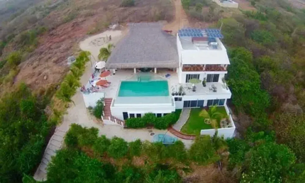 Omkara Healing Retreat — The retreat is set within a stunning oceanfront villa in Puerto Escondido, Mexico. Guests are enveloped by lush greenery and vibrant flowers, creating an atmosphere of instant relaxation and natural beauty. The peaceful surroundings and luxurious accommodations offer a safe and pampering environment for healing and personal growth, all against the backdrop of a unique Mexican beach town.