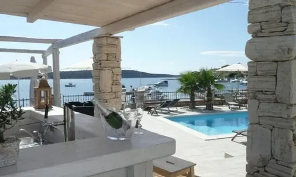 Papalina retreats — Perched on the idyllic Rab Island, Papalina Retreats offers a tranquil escape right by the crystal-clear Adriatic Sea. The setting combines the natural beauty of hidden beaches and coves with the historical charm of a medieval town, all under the warm Mediterranean sun. Guests can expect breathtaking sea views and lush gardens surrounding their accommodation.