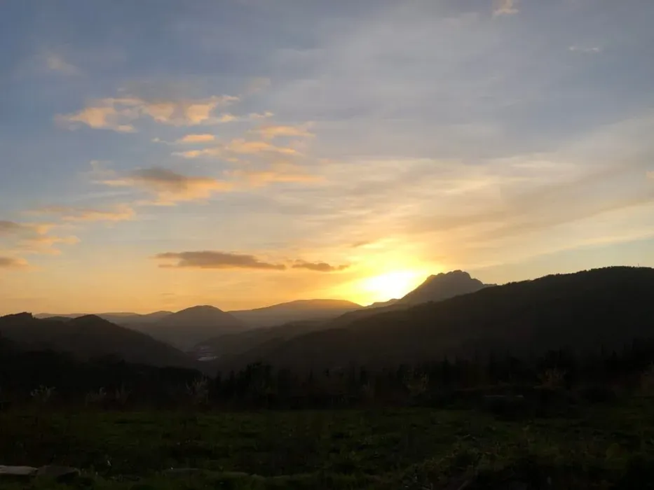 Primal Nature — Primal Nature is situated on a small mountaintop, offering breathtaking panoramic views of the surrounding landscape. While providing a sense of elevated tranquility, it's not entirely isolated, with the nearest town just a short 10-minute drive away.