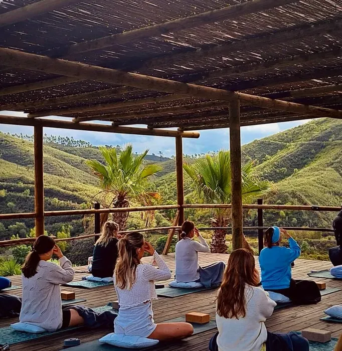 Project Within — The retreat is situated in the picturesque Algarve region of Portugal, specifically in Falacho de Cima. It takes place at Moodz Spa & Resort, an elegant wellness resort set amidst the green hills. This location offers a tranquil natural environment, blending comfort and care to create a space conducive to relaxation and wellbeing.
