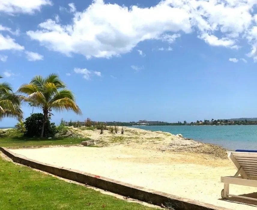 Radiant Soul Yoga Retreat — The retreat unfolds at The Wharf House, a beautiful and historic 18th-century property set on the tranquil shores of the Montego Bay Lagoon. This saltwater inlet, part of the Montego Bay Marine Park, provides a picturesque backdrop of calm waters and lush natural beauty. The intimate villa setting, surrounded by the Caribbean Sea, fosters a deep connection with nature and a sense of peaceful seclusion.
