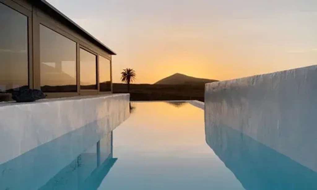Radiantes Retreats — The retreat is held on the captivating island of Lanzarote, one of the Canary Islands, renowned for its distinctive volcanic terrain. The climate is consistently mild, typically ranging from 20 to 25 degrees Celsius year-round, offering a comfortable environment for reflection and outdoor activities amidst the dramatic scenery.