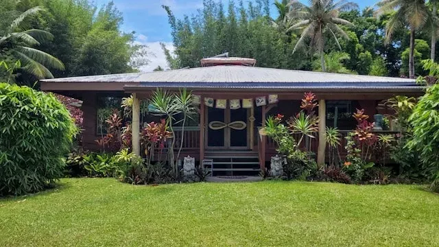 Reach for the Ground — The center is set on a three-acre, off-grid property in Kapoho, on Hawaii's Big Island. The surrounding area is rich with natural wonders, including newly formed black sand beaches from the 2018 lava flow, ancient tide pools, sacred waterfalls, and lush botanical gardens. The atmosphere is one of serene natural beauty, offering a deep connection to the island's unique volcanic landscape and vibrant marine life.