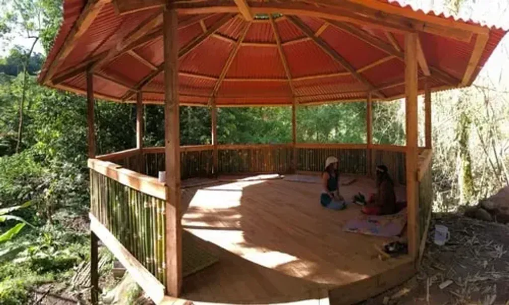 Reconnect with your Indigenous Soul — The center is situated within the breathtaking Manu Biosphere Reserve in Peru's Valle Cosñipata, an area renowned for its rich biodiversity and lush Amazonian rainforest. The environment is wild and immersive, with trails winding through dense jungle to a beautiful waterfall, offering a constant connection to nature's sights and sounds. Expect to be surrounded by vibrant plant life, exotic birds, and a myriad of butterflies, creating a truly enchanting and restorative atmosphere.