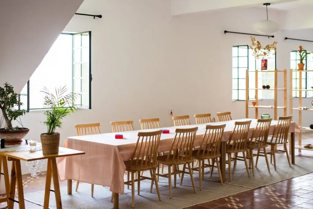Reframe. Renew. Refocus — The center is situated in Bela Colina, a location that suggests a peaceful, perhaps rural, Portuguese landscape. The atmosphere is geared towards personal renewal and quiet introspection, away from the distractions of daily life.