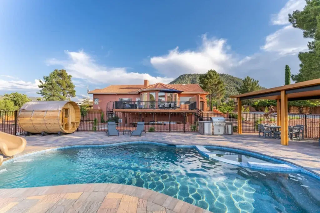 Sacred Spaces Kollectiv — set in Sedona’s Village of Oak Creek, this retreat boasts a sprawling one-acre property where luxury seamlessly meets nature. The stunning red rock landscapes provide a breathtaking backdrop, creating an atmosphere of tranquility and inspiration. Expect expansive outdoor living spaces designed for relaxation and connection with the natural beauty of Arizona.