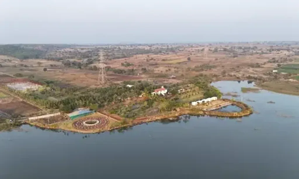 Samadhi Hermitage Retreat center — The retreat is situated in the tranquil Dhamangaon Village, close to the famous Ellora Caves in Maharashtra, India. Surrounded by natural farms, rolling hills, and expansive open skies, it offers a quiet and authentic rural environment. This setting is perfectly suited for deep meditation and inner work, providing a peaceful escape from urban distractions.