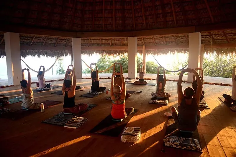 Satya Yoga — Zazil Retreat is set on a hillside, providing stunning views of the tranquil San Agustinillo Bay. The environment is characterized by lush vegetation and open skies, creating a peaceful atmosphere where the natural world dictates the pace. It's an intimate setting on Oaxaca’s unspoiled coastline, designed for quiet contemplation and self-reconnection.