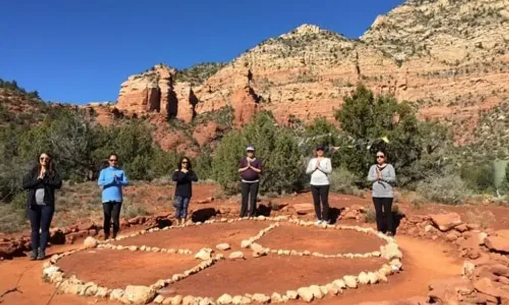 Sedona Spirit Yoga, Healings & Vortex Journeys — Located in Cottonwood, Arizona, the center is at the foot of Sedona's majestic red rock vortexes, renowned for their energetic properties. The Pines Inn & Suites provides a comfortable base, with balconies and a swimming pool, all within walking distance of local restaurants and shops. The area offers a serene backdrop for spiritual exploration and connection with nature.