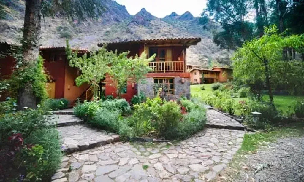 Seven Retreats — set in Urubamba, Peru, the retreat is situated in the heart of the Sacred Valley of the Incas. The lodge offers a harmonious blend of rustic charm and modern comfort, surrounded by stunning Andean mountains and beautiful gardens, creating a serene and luxurious atmosphere.